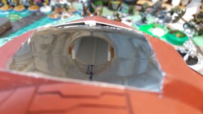 Hole in the nose. The original shape was a mouthwash bottle built up with styrene plastic sheet and putty. Click for larger.